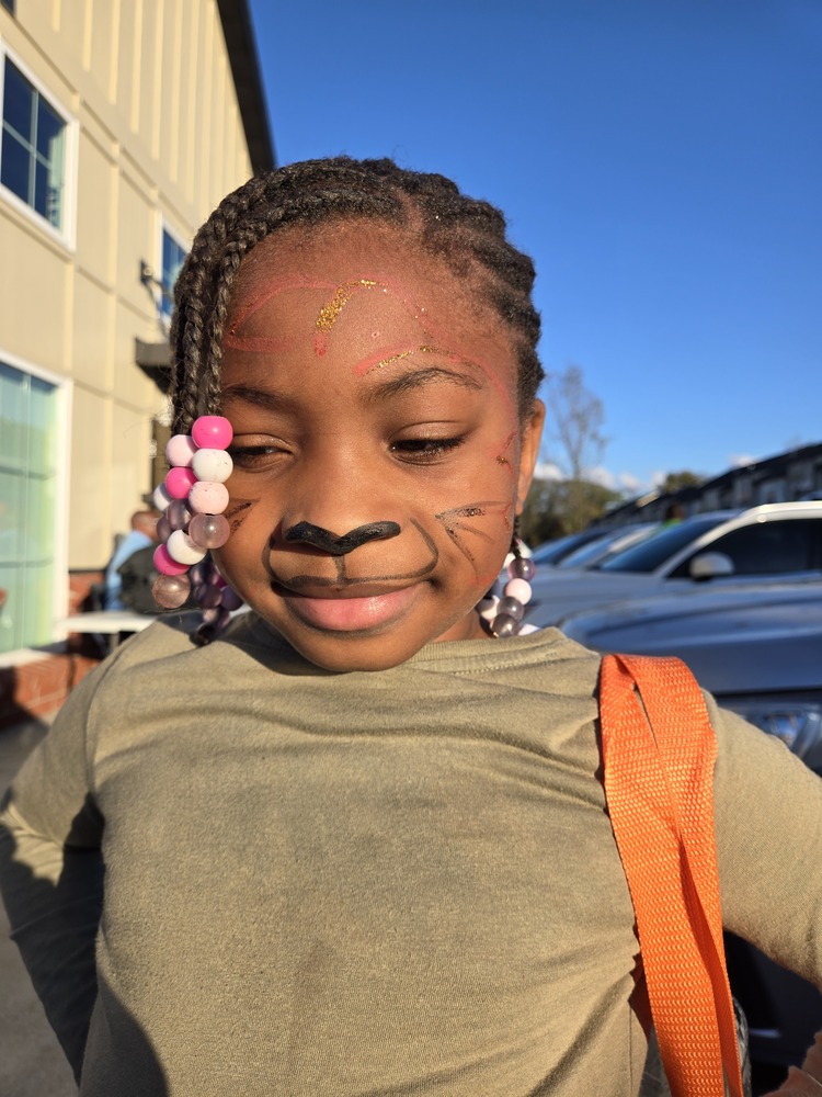 Resident child with tiger face paint